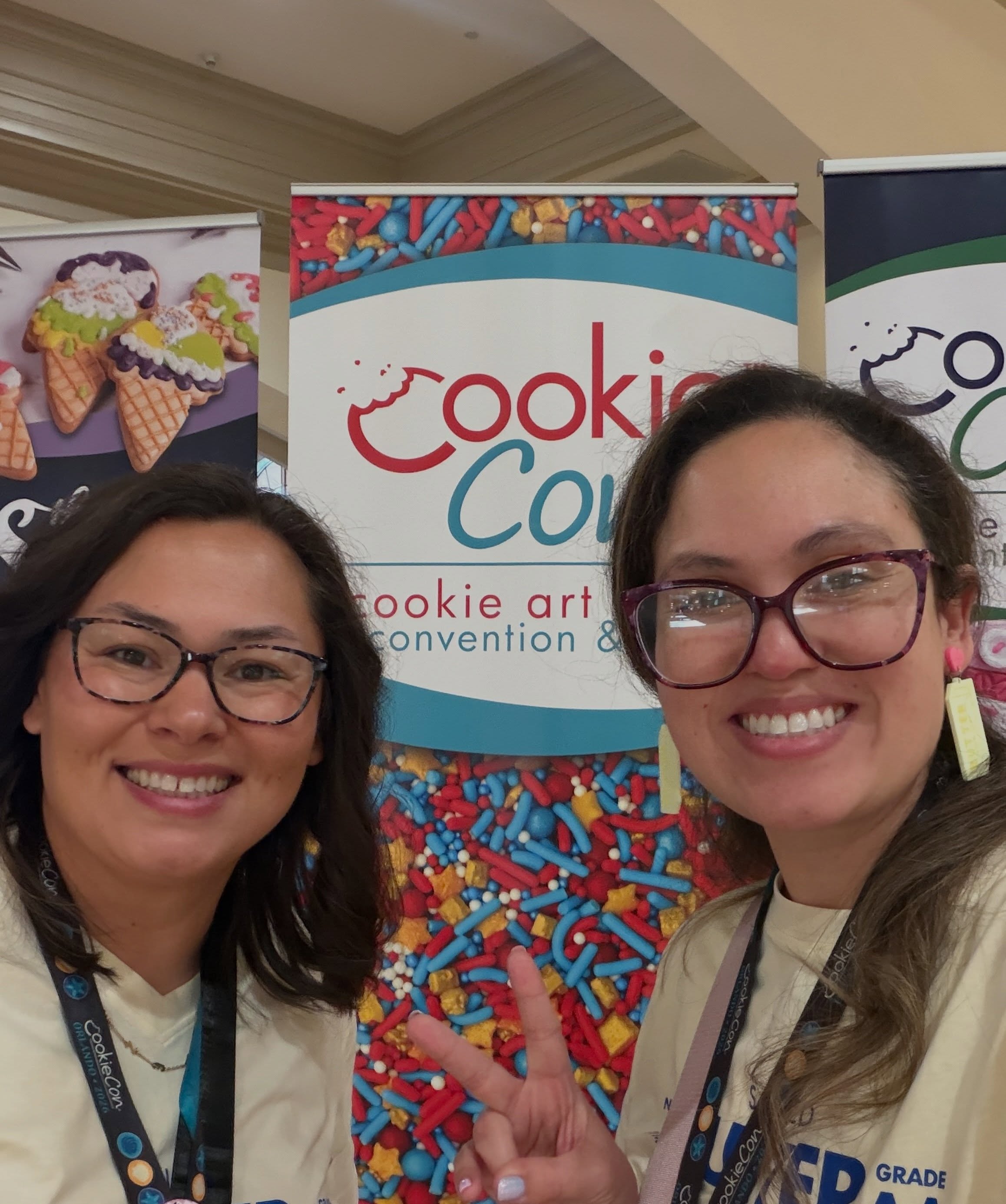 CookieCon selfie in front of the event banner
